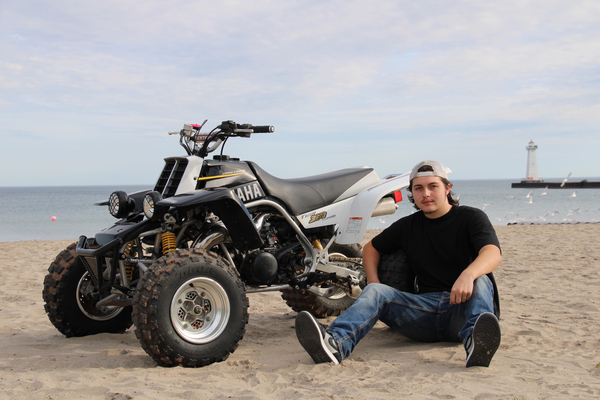 Jaxon Wright with machines in the woods