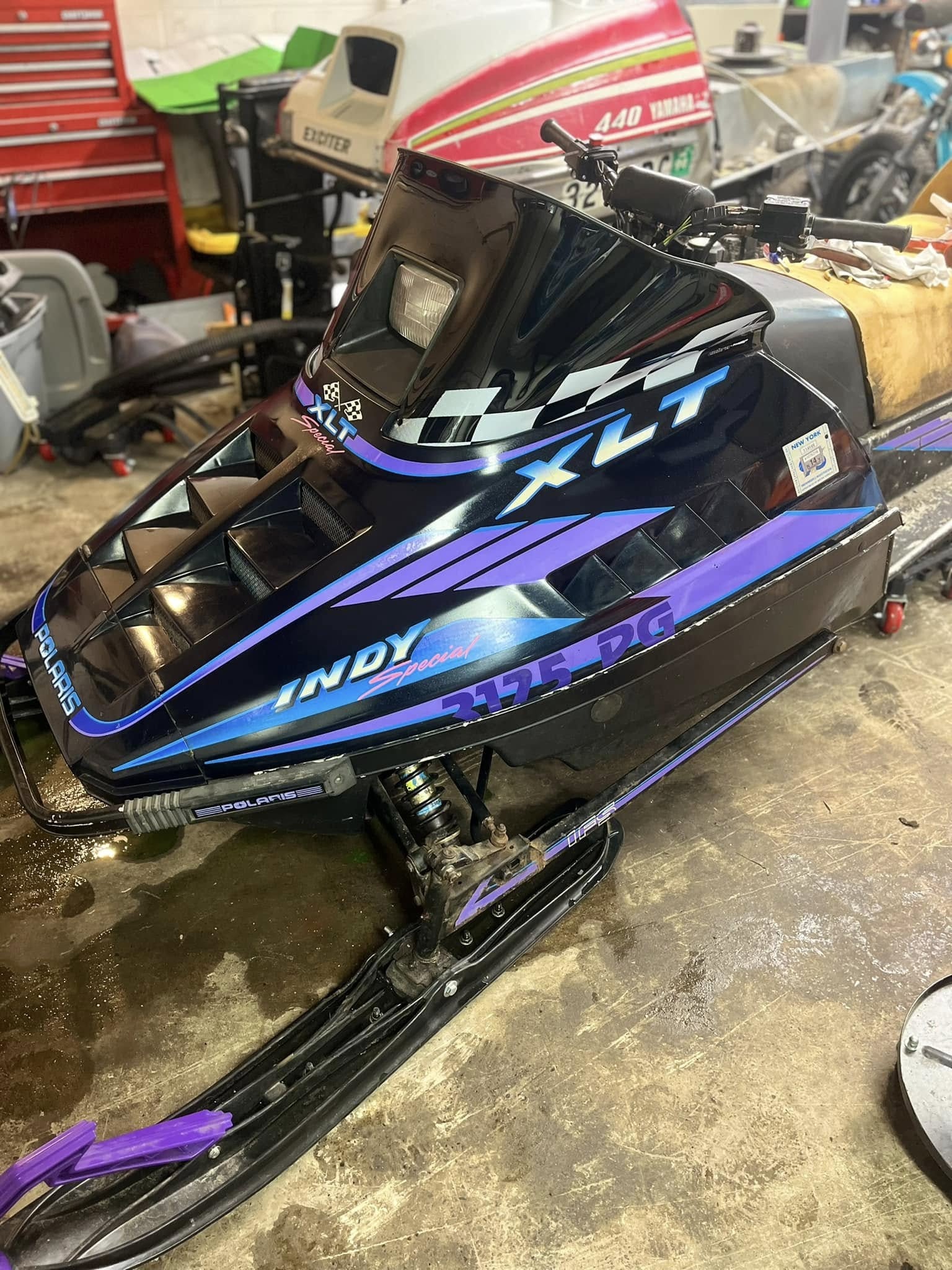 Black and purple snowmobile
